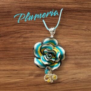 💙💛Pretty Hawaiian  plumeria polymer clay pendant with cord